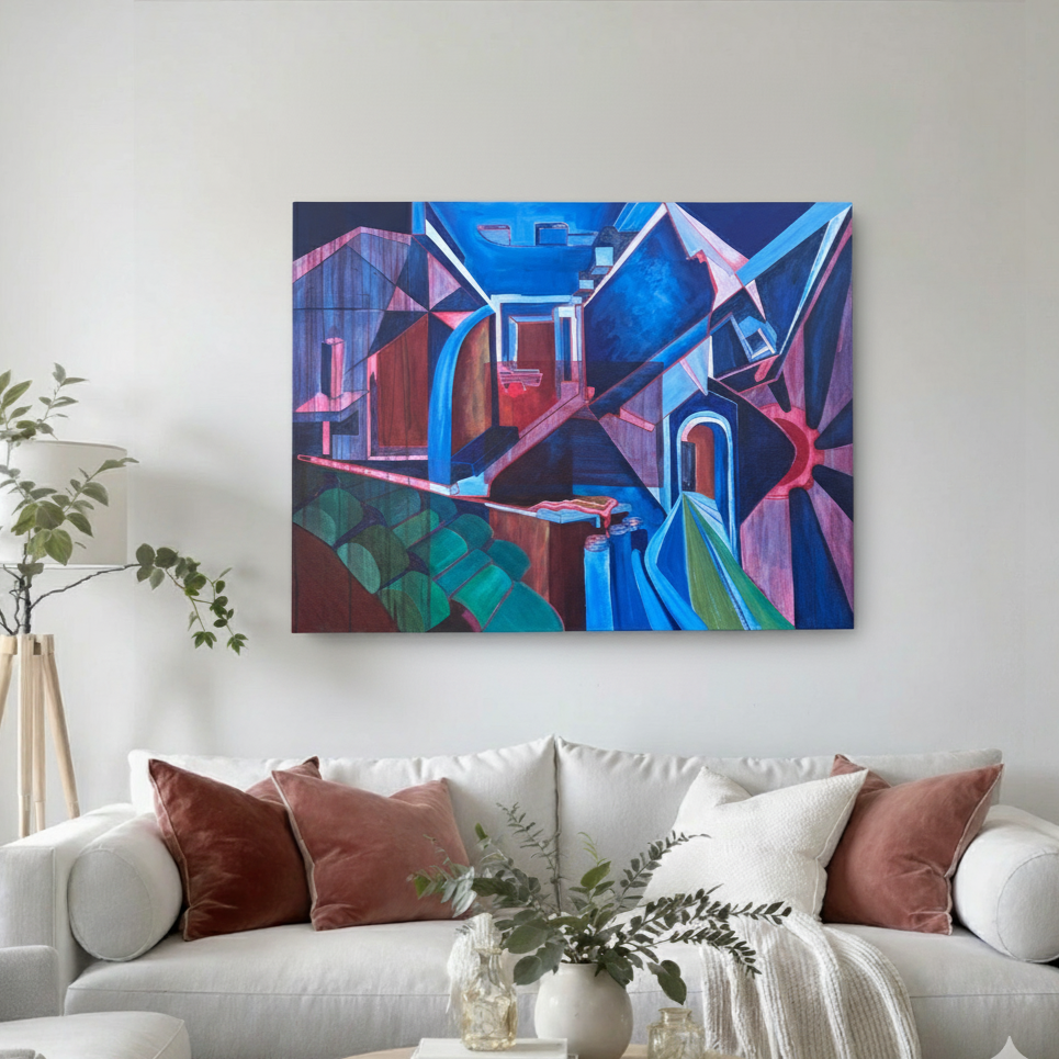 Abstract geometric painting in blue, pink and red architectural shapes, staged above a white sofa with rust pillows